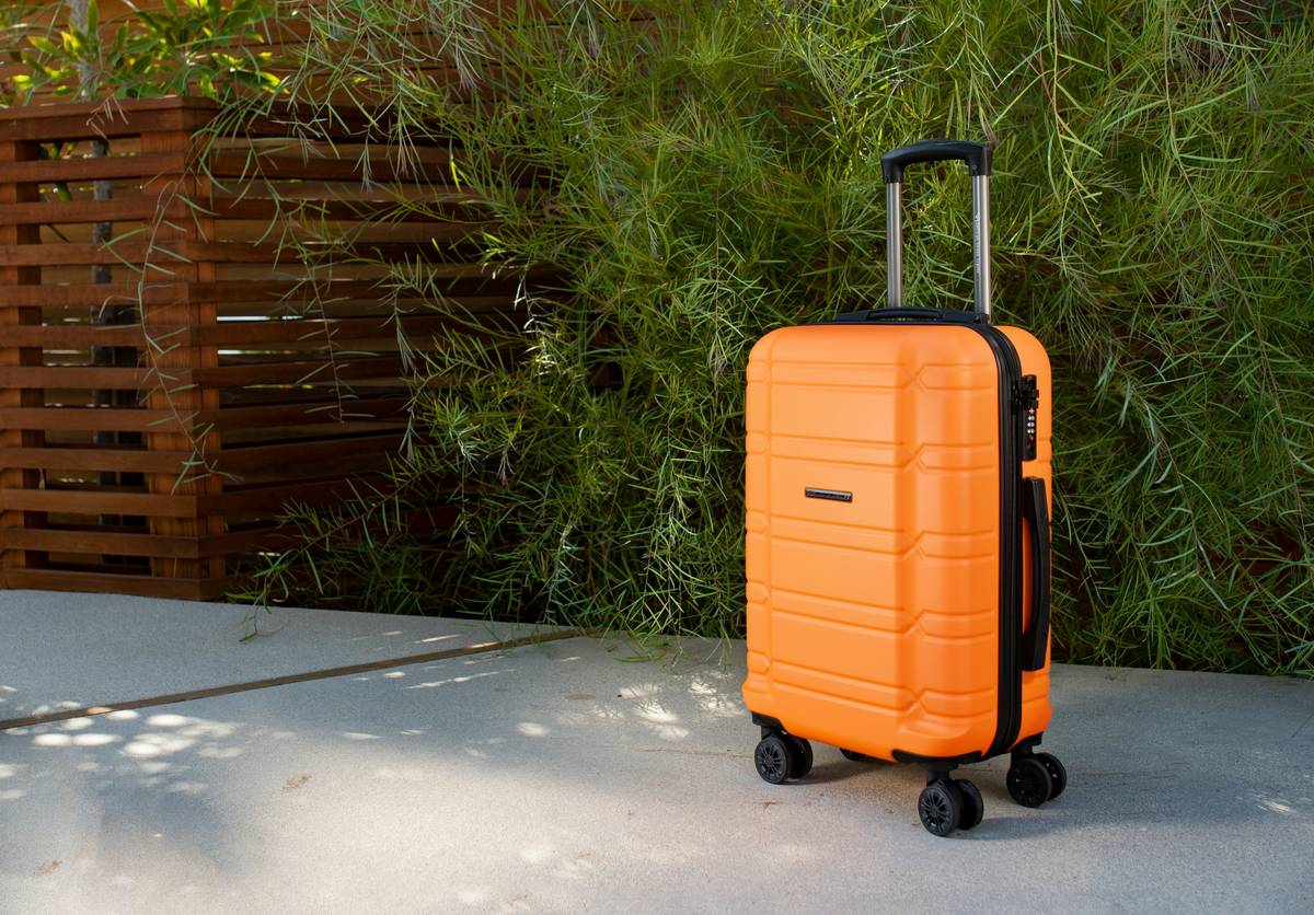 Sturdy travel bag surviving drop test on airport tarmac