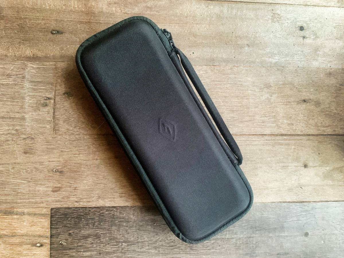 Side-by-side drop test comparison between regular hardshell suitcase and shockproof travel bag